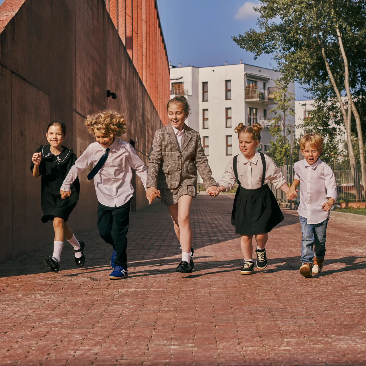Children heading back to school wearing shoes from the BARTEK collection, available at WOJAS stores.