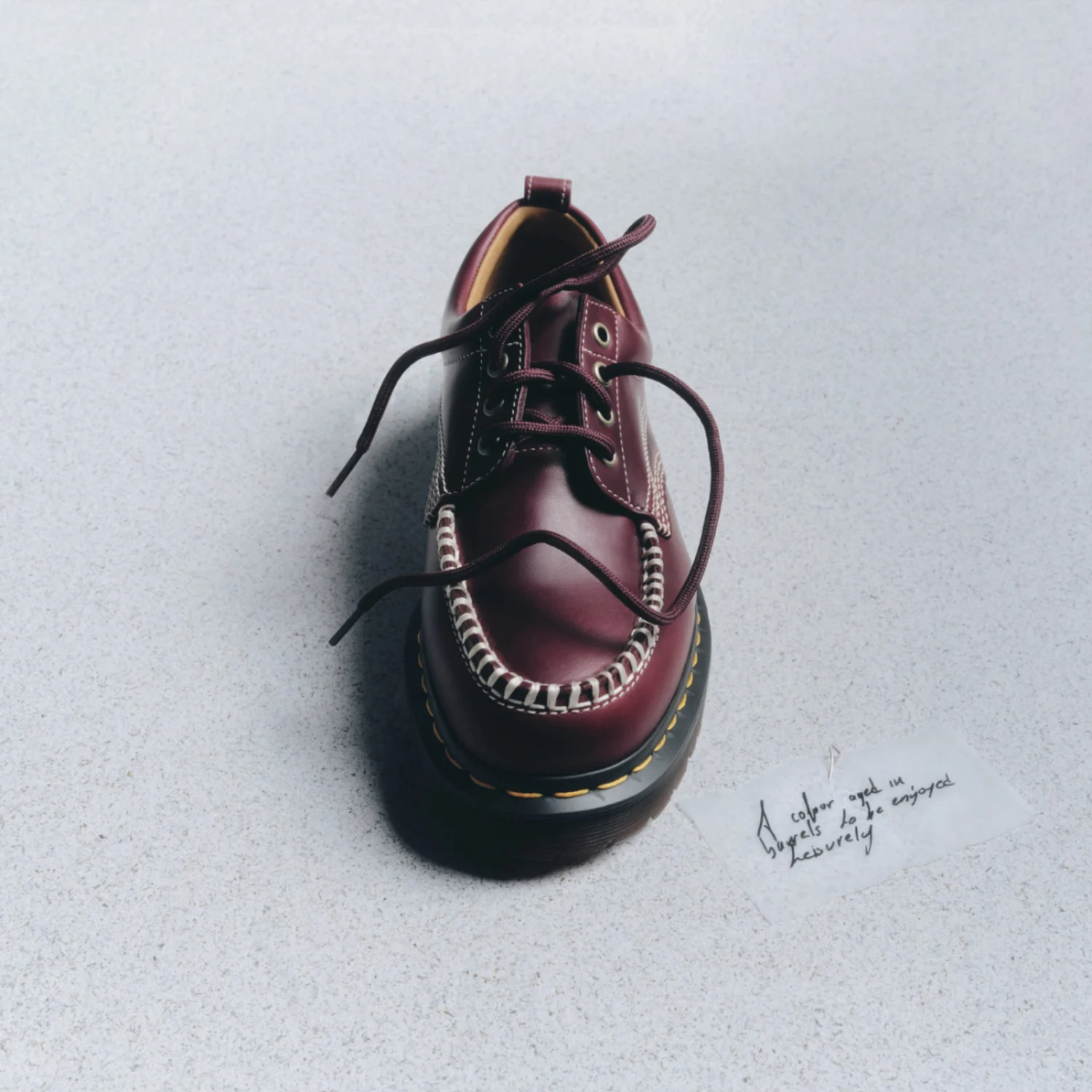 Brown shoe on a gray background