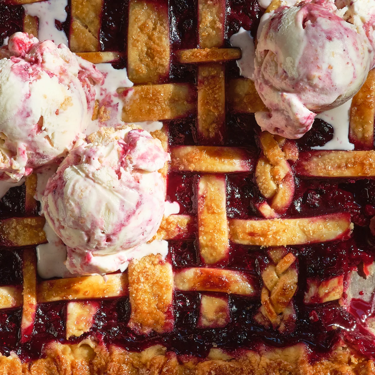 Ice cream scoops on top of a pie
